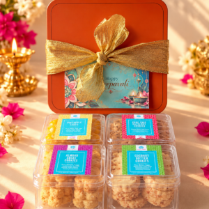 Festive Bliss Deepavali cookie gift box with four cookie varieties in an orange metal tin decorated with a gold ribbon