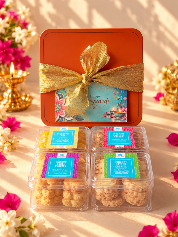 Festive Bliss Deepavali cookie gift box with four cookie varieties in an orange metal tin decorated with a gold ribbon